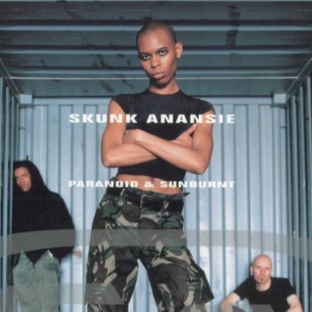The album cover for the album 'Paranoid & Sunburnt' by Skunk Anansie, featuring three band members, most prominently lead singer Skin with arms folded.